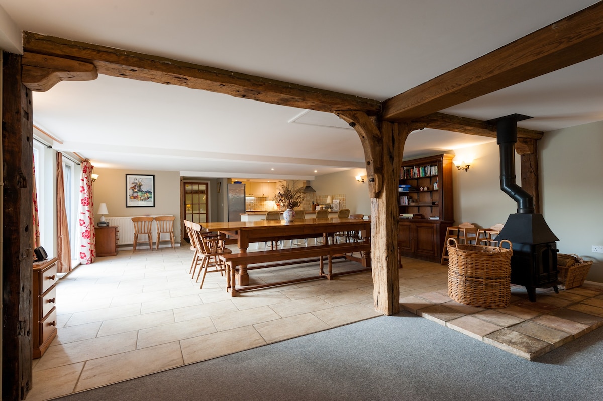 An open-plan beamed dining and living space